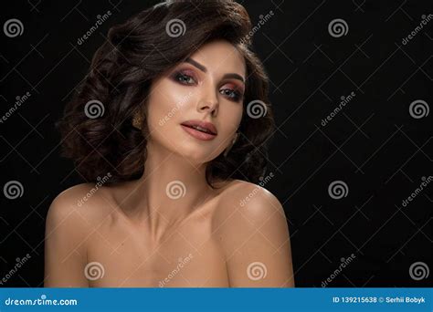 Seductive Lady With Naked Shoulders Looking At Camera Stock Photo