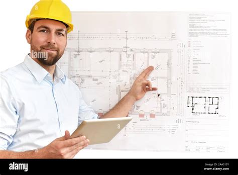 Architect Engineer At His Desk Planning The Construction Of A House