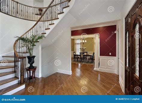 Foyer In Luxury Home With Curved Staircase Stock Photo Image Of