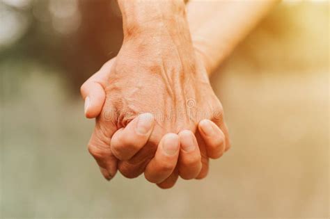 Happy Senior Couple Holding Hands Hands Of Man And Woman Hold Each