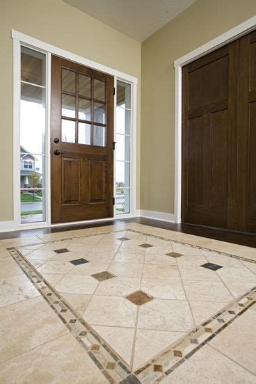 Natural hardwood floors look great no matter how simple the design is. amazing foyer tile floor designs | 12 Excellent Foyer ...