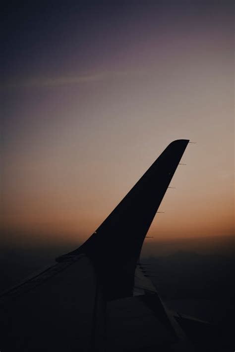 Wing Of An Airborne Airplane · Free Stock Photo