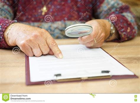Elderly Person With Magnifying Glass Checking Document Stock Image Image Of Hospice