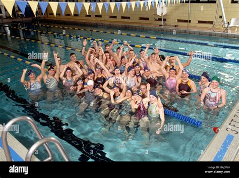 Group Portrait Of Teenage Boys And Girls On A High School Swim Team In