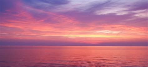 A Beautiful Pink And Purple Sunset Over An Ocean Background Cloud Sea