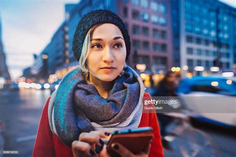 Woman Using Mobile Phone In A Street High Res Stock Photo Getty Images