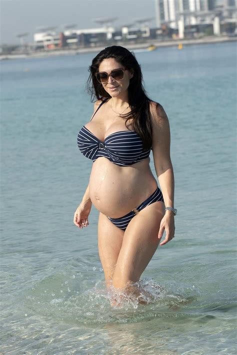 Casey Batchelor Shows Off Her Baby Bump In A Striped Bikini While