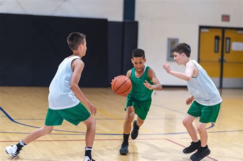 Elementary Boys Playing Basketball Stock Photo Download Image Now