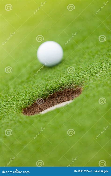 Golf Ball On The Edge Of Hole Stock Photo Image Of Background