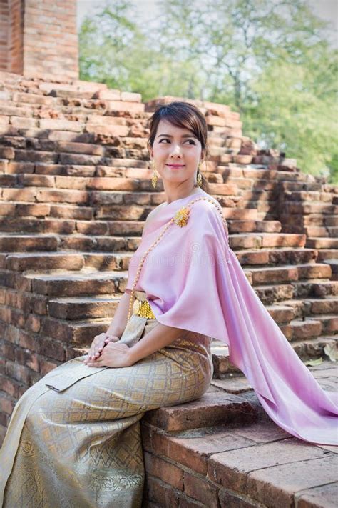 Women Sit Wearing Traditional Cloth Thailand Or Thai Dress In Ancient