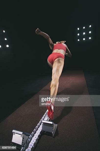 Female Sprinter In Starting Blocks Photos And Premium High Res Pictures