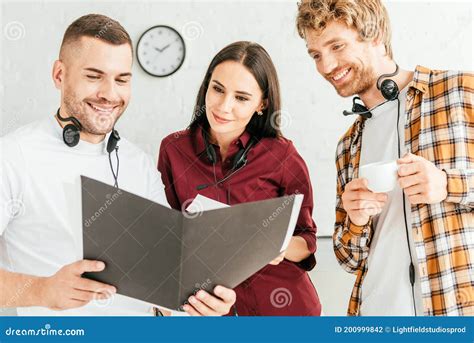 Happy Brokers Looking At Folder And Stock Photo Image Of Adult