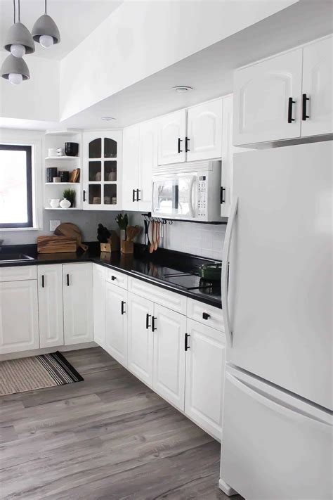 The cool white finish of the boards catches the incoming light from the windows, leaving the space bright, fresh, and spacious while the nicely contrasting muted colors on the flooring further enhances the aesthetic. Our Weekend Renovation: A New Modern Kitchen - Love Create ...