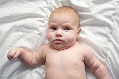 Closeup Portrait Of Newborn Baby On White Blanket Soft Focus Infant