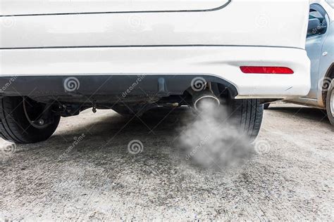 Combustion Fumes Coming Out Of Car Exhaust Pipe Air Pollution Concept