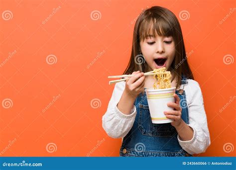 Cute Little Girl Eating Ramen Noodles Stock Photo Image Of Studio