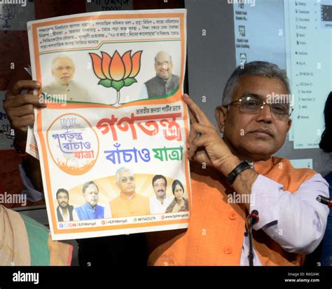 west bengal bharatiya janata party or bjp president dilip ghosh holds the poster of gantantra