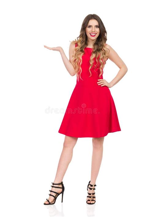 Beautiful Young Woman In Red Mini Dress Is Holding Hand Raised