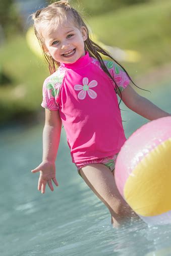 Cute Little Girl Playing In Water Stock Photo Download Image Now Istock