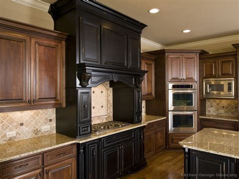 Stained and painted cabinetry that displays antiquing, distressing, chaining. Old World Kitchen Designs - Photo Gallery
