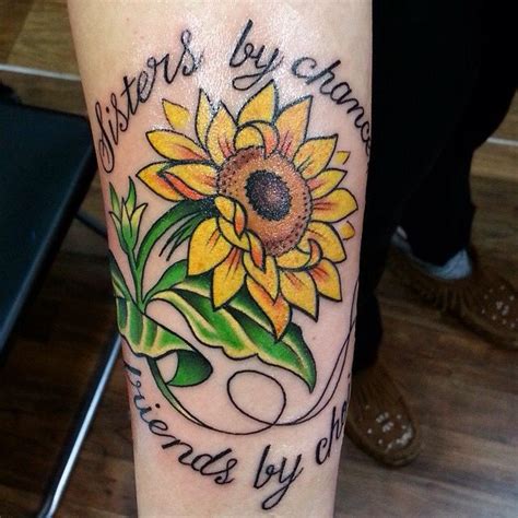 A Sunflower With The Words Sisters By Chance On Its Leg And Some Leaves