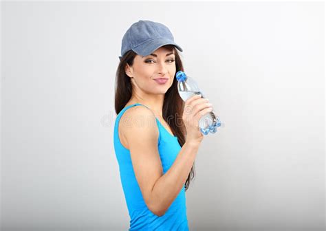 Beautiful Happy Sporty Slim Woman Drinking Water From Bottle After