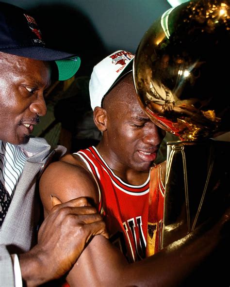 Michael Jordan holding the first Bull's Championship Trophy in 1991
