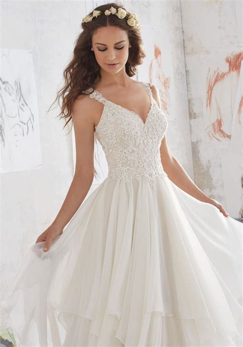 Yoke is finely pleated horizontally. Morilee by Madeline Gardner's Blu Wedding Dresses ...