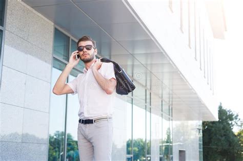 Pensive Executive Holding Phone Outdoors Photos Free And Royalty Free