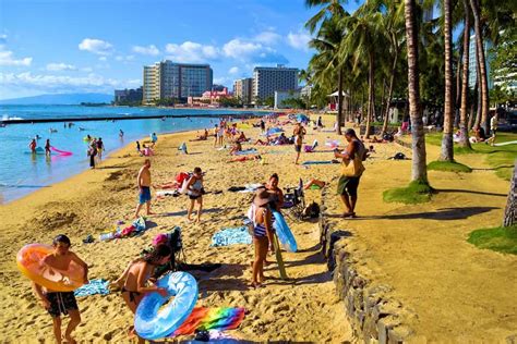 Waikiki Beach In Honolulu Hi Popular Crowded Beach Surrounded By Palm