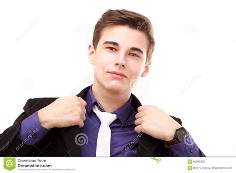 Portrait Of An Attractive Young Businessman Correcting His Jacket Stock
