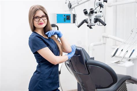 Portrait Of Beautiful Female Dentist At The Modern Dental Office Stock