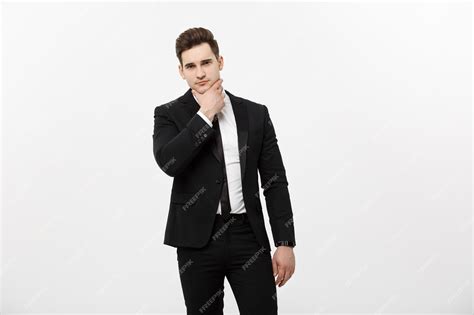 Premium Photo Young Handsome Man In Black Suit And Glasses Looking At