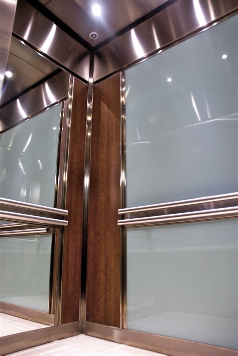 The Rear Wall Of This Elevator Interior Is Fitted With Back Painted