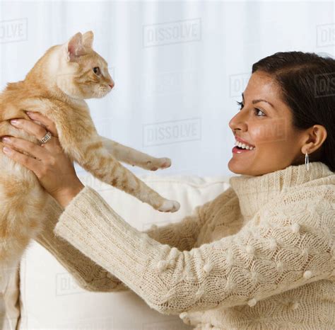 Indian Woman Holding Cat Stock Photo Dissolve