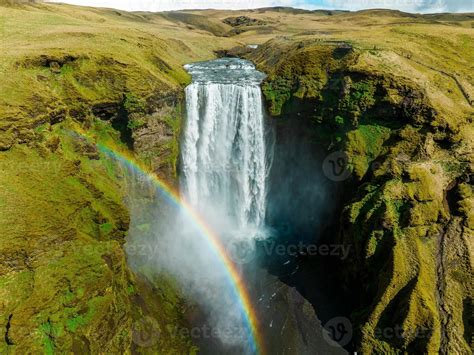 Famous Skogafoss Waterfall With A Rainbow Dramatic Scenery Of Iceland