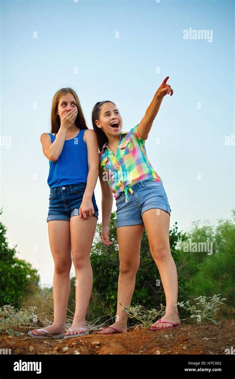 Best Friends Forever Two 12 Year Old Teenage Girls Standing On A Hill