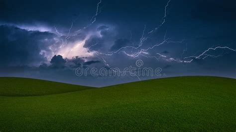 Lightning Stormthunderstorm With Lightning In A Green Meadow Stock