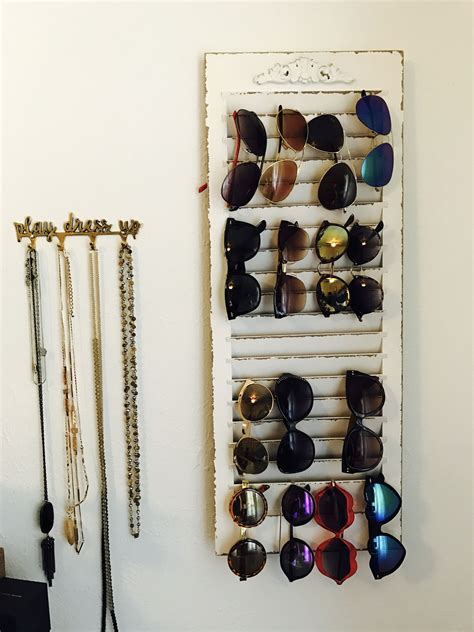 Sunglass rack/organizer diy | superholly. DIY Sunglasses holder made from window shutter. #DIYHomeDecorRental | Sunglasses storage diy ...