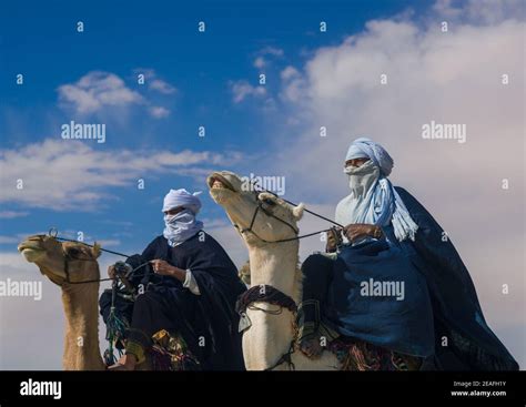 Tuareg Men Riding Camels Tripolitania Ghadames Libya Stock Photo Alamy