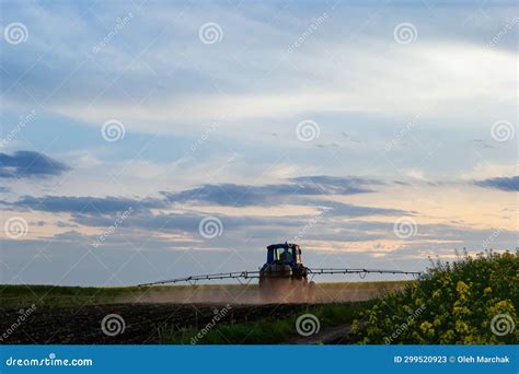 Tractor Spraying Pesticides On Vegetable Field With Sprayer At Spring Stock Image Image Of