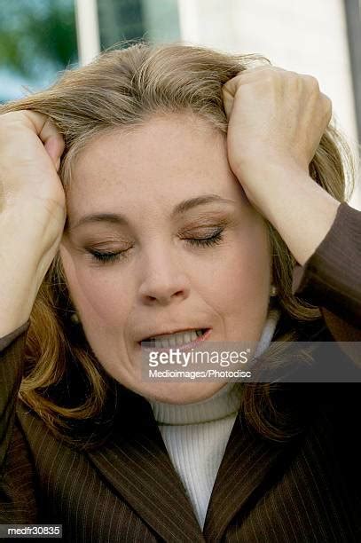 pulling up hair photos and premium high res pictures getty images