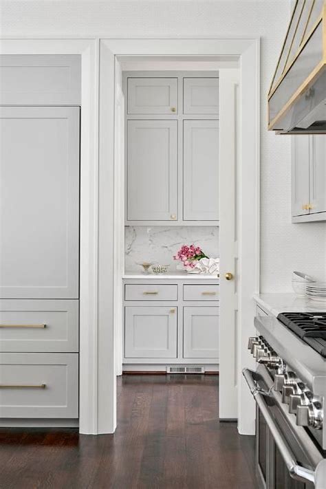 Maybe you would like to learn more about one of these? A white pocket door opens to a pantry fitted with light ...