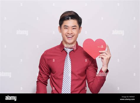 I Love You Handsome Young Man Holding Heart Shaped Valentine Card And Smiling While Standing