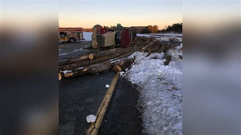 Logging Truck Overturns Spills Logs After Rear Ending Farm Tractor