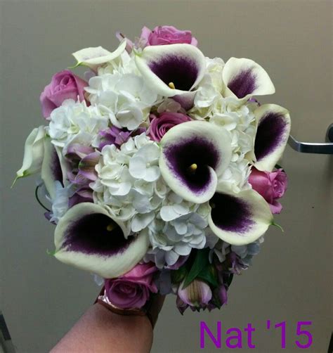 top view of the bouquet picasso calla lilies hydrangeas roses alstroe variegated pitt bib