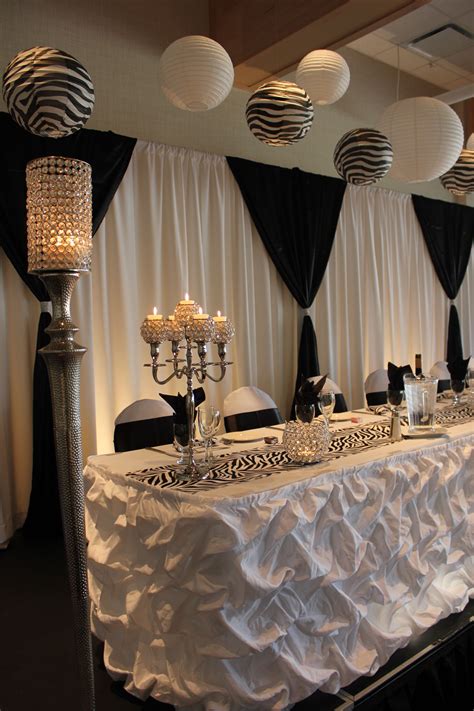White and black backdrop, puffy barrel table skirt Head Table Decor