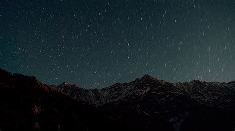 Download Wallpaper 1366x768 Mountain Starry Sky Night Glitter