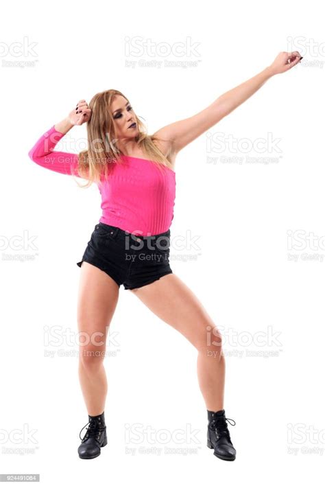 Posing Of Young Blonde Active Woman Dancing Jazz Dance With Stretched