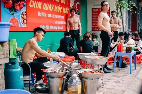 Hot Shirtless Men Cooking And Serving In A Vietnamese Roadside Diner